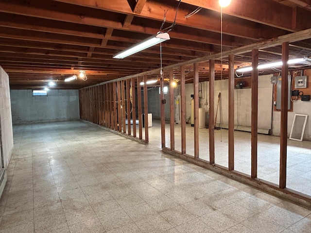 402 6th St NE, Barnesville, MN 56514 - unfinished basement with gas water heater and tile patterned floors