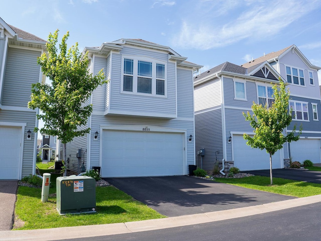 8055 Arrowwood Ln N, Maple Grove, MN 55369 - view of front of house featuring a garage and driveway