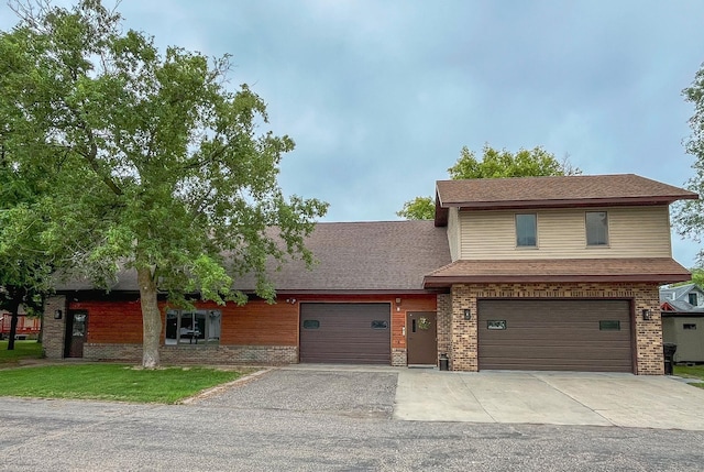 405 Fir Ave, Frazee, MN 56544 - view of front of property with driveway, brick siding, and an attached garage