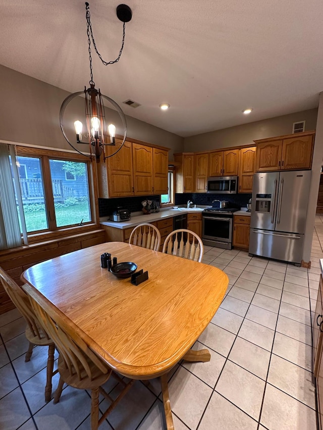 405 Fir Ave, Frazee, MN 56544 - dining space featuring light tile patterned flooring, a chandelier, and recessed lighting