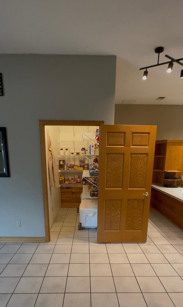 405 Fir Ave, Frazee, MN 56544 - corridor with rail lighting and light tile patterned floors