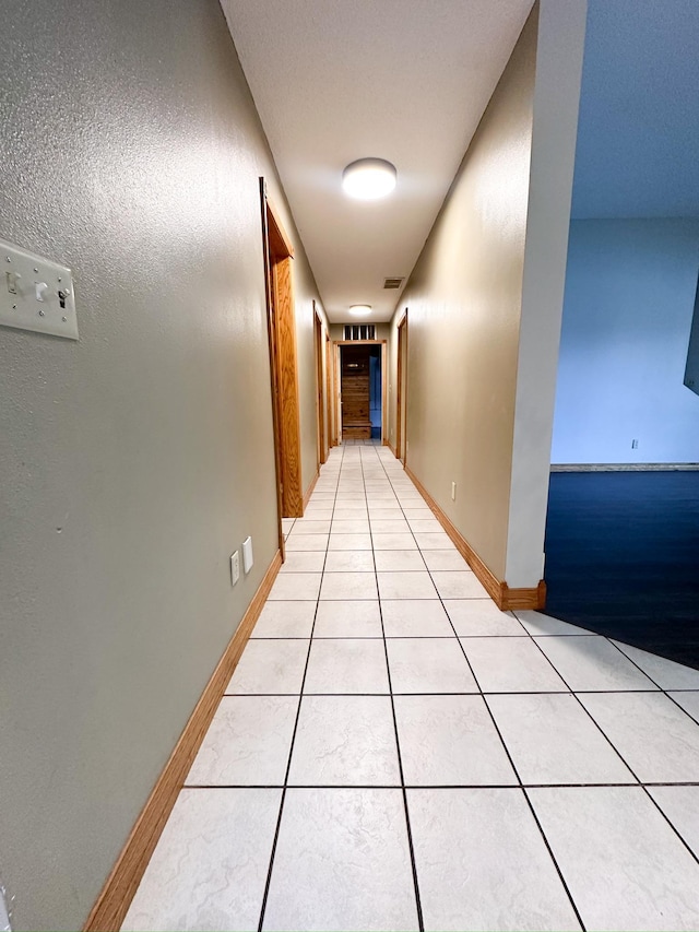 405 Fir Ave, Frazee, MN 56544 - corridor featuring light tile patterned floors and baseboards