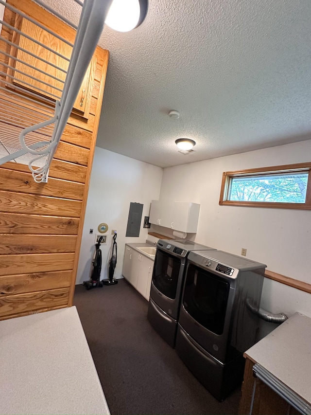 405 Fir Ave, Frazee, MN 56544 - laundry room with cabinet space, washer and dryer, a textured ceiling, electric panel, and dark colored carpet