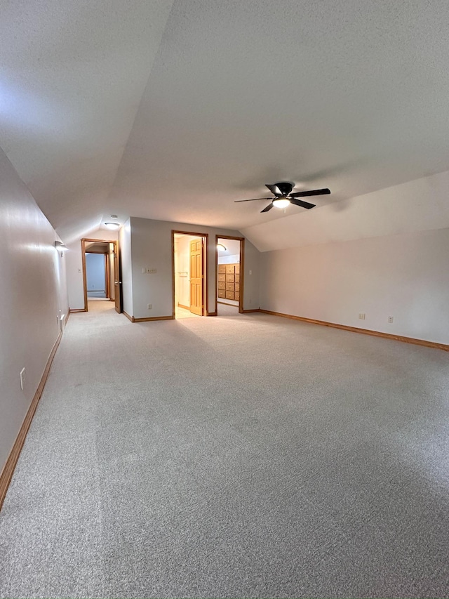 405 Fir Ave, Frazee, MN 56544 - spare room featuring lofted ceiling, ceiling fan, and light carpet