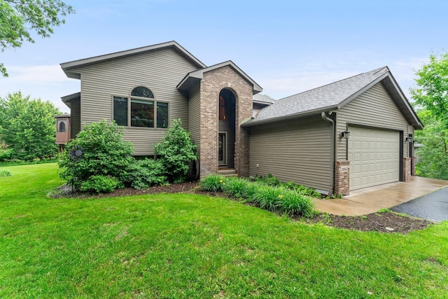 26943 140th St NW, Zimmerman, MN 55398 - view of front of property featuring brick siding, asphalt driveway, an attached garage, a front yard, and roof with shingles