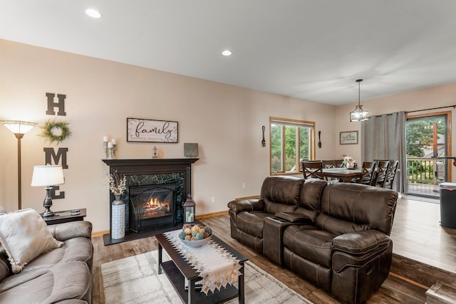 26943 140th St NW, Zimmerman, MN 55398 - living room with wood finished floors, a high end fireplace, and recessed lighting