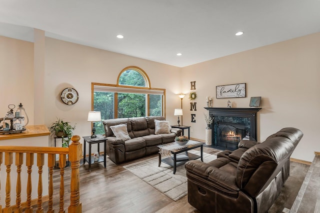 26943 140th St NW, Zimmerman, MN 55398 - living room featuring a premium fireplace, recessed lighting, and wood finished floors