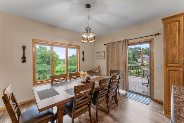 26943 140th St NW, Zimmerman, MN 55398 - dining room featuring light wood-type flooring and a chandelier