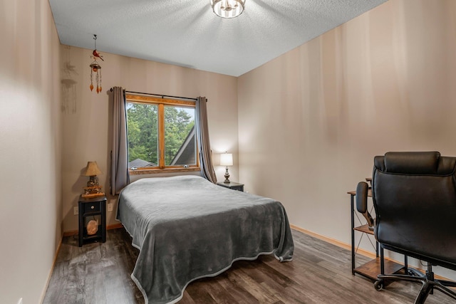 26943 140th St NW, Zimmerman, MN 55398 - bedroom with wood finished floors and a textured ceiling