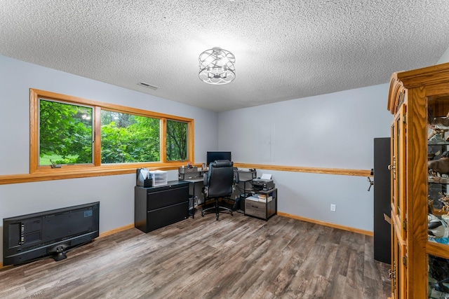 26943 140th St NW, Zimmerman, MN 55398 - office area with wood finished floors and a textured ceiling