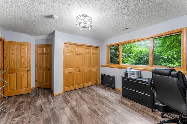 26943 140th St NW, Zimmerman, MN 55398 - office area featuring wood finished floors and a textured ceiling