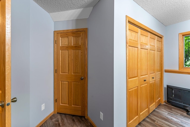 26943 140th St NW, Zimmerman, MN 55398 - corridor featuring a textured ceiling and wood finished floors