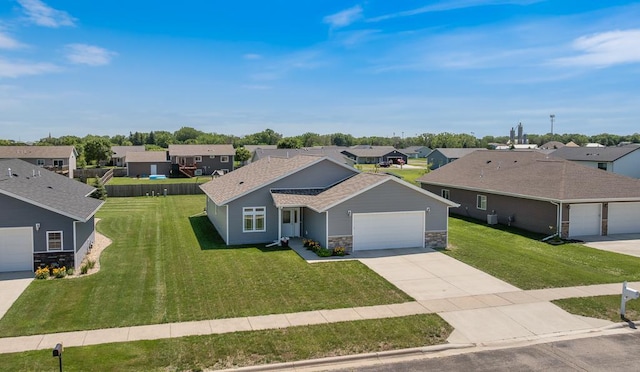 307 Brussels Ct, Marshall, MN 56258 - view of front facade with a residential view, stone siding, driveway, and an attached garage