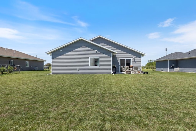 307 Brussels Ct, Marshall, MN 56258 - rear view of house with a yard and a patio