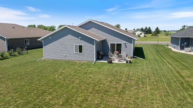 307 Brussels Ct, Marshall, MN 56258 - rear view of property featuring a patio area and a lawn
