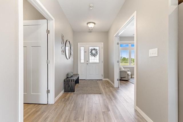 307 Brussels Ct, Marshall, MN 56258 - entryway featuring light wood finished floors and baseboards