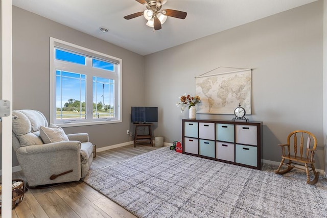 307 Brussels Ct, Marshall, MN 56258 - sitting room featuring wood finished floors and a ceiling fan
