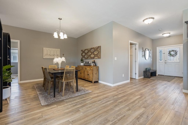 307 Brussels Ct, Marshall, MN 56258 - dining space with a chandelier and light wood finished floors