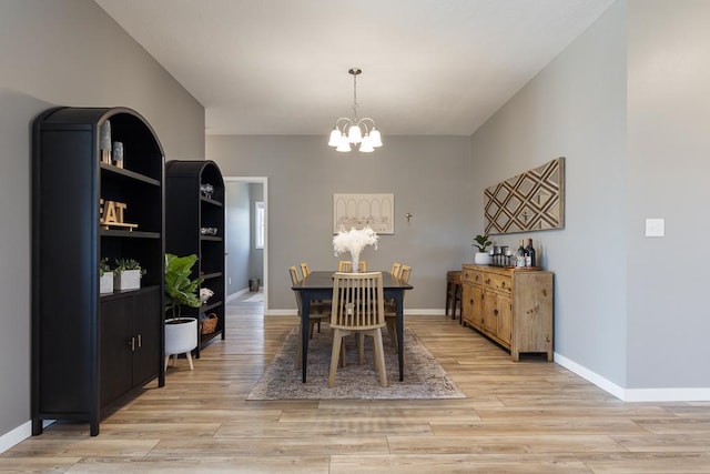 307 Brussels Ct, Marshall, MN 56258 - dining area with a chandelier and light wood finished floors