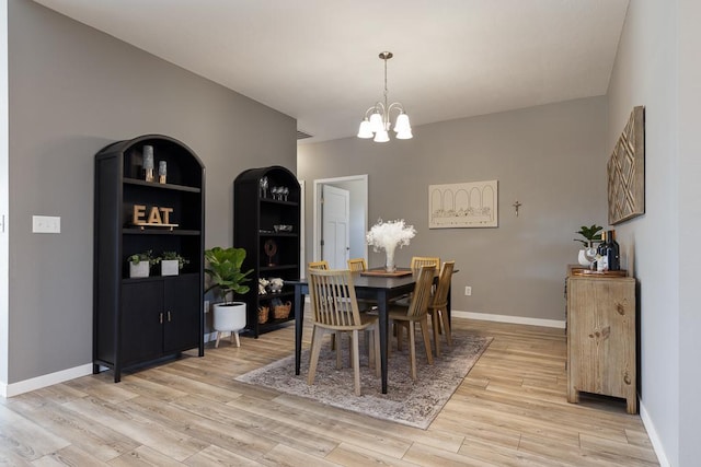 307 Brussels Ct, Marshall, MN 56258 - dining area featuring a chandelier and light wood-type flooring