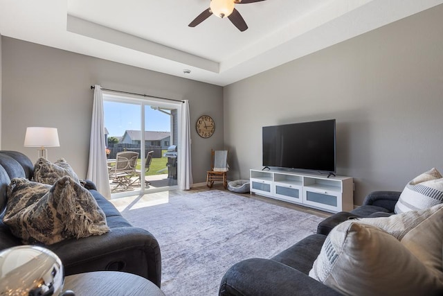 307 Brussels Ct, Marshall, MN 56258 - living area with a ceiling fan, a raised ceiling, and wood finished floors
