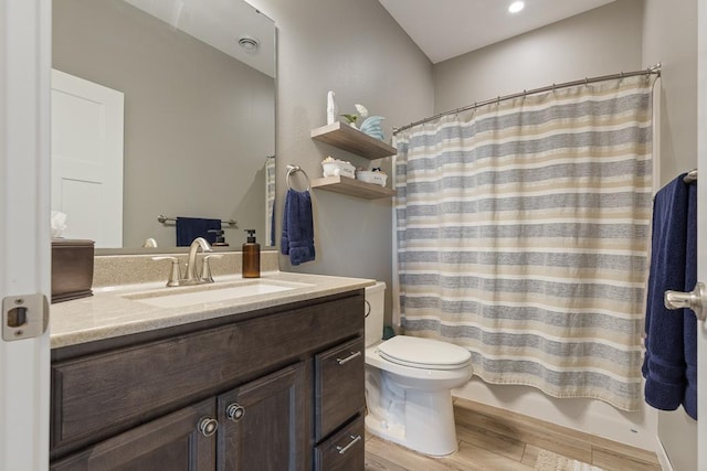 307 Brussels Ct, Marshall, MN 56258 - bathroom with vanity, wood finished floors, and a shower with shower curtain