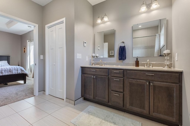 307 Brussels Ct, Marshall, MN 56258 - ensuite bathroom featuring double vanity and tile patterned floors