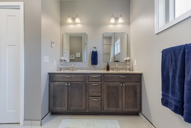307 Brussels Ct, Marshall, MN 56258 - bathroom featuring double vanity and tile patterned floors