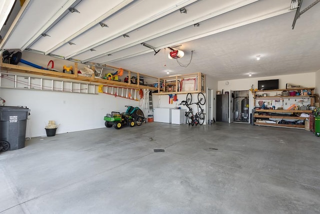 307 Brussels Ct, Marshall, MN 56258 - garage featuring a garage door opener and water heater