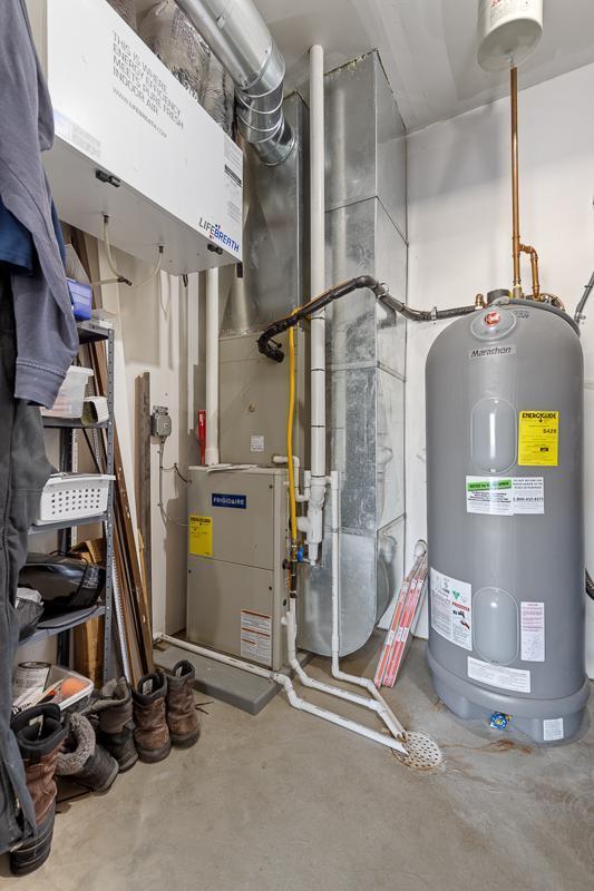 307 Brussels Ct, Marshall, MN 56258 - utility room featuring electric water heater