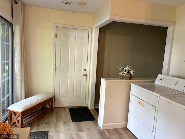 1904 Parkview Rd NE, Alexandria, MN 56308 - washroom featuring washer and clothes dryer, light wood finished floors, and healthy amount of natural light