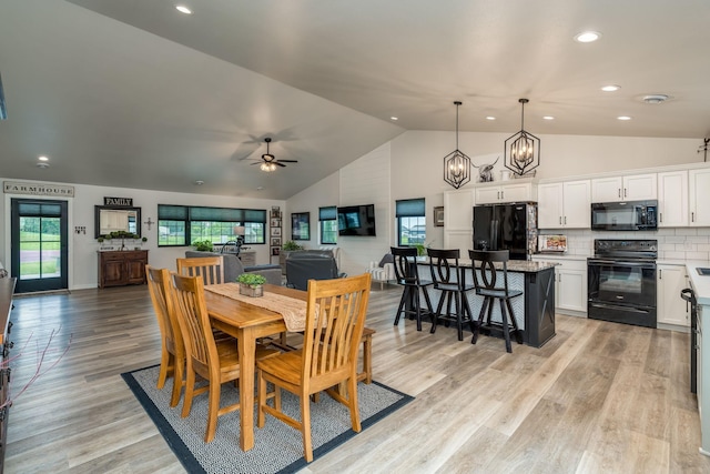 101 Butterfly Ct, Blue Earth, MN 56013 - dining area featuring recessed lighting, light wood-style flooring, ceiling fan, a chandelier, and high vaulted ceiling