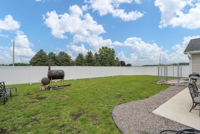 101 Butterfly Ct, Blue Earth, MN 56013 - fenced backyard featuring a patio and oil tank