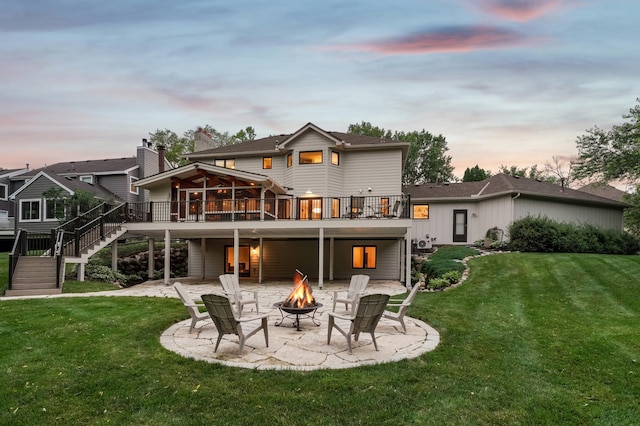 5705 Covington Cir, Minnetonka, MN 55345 - back of property featuring an outdoor fire pit, a patio area, a wooden deck, and stairway