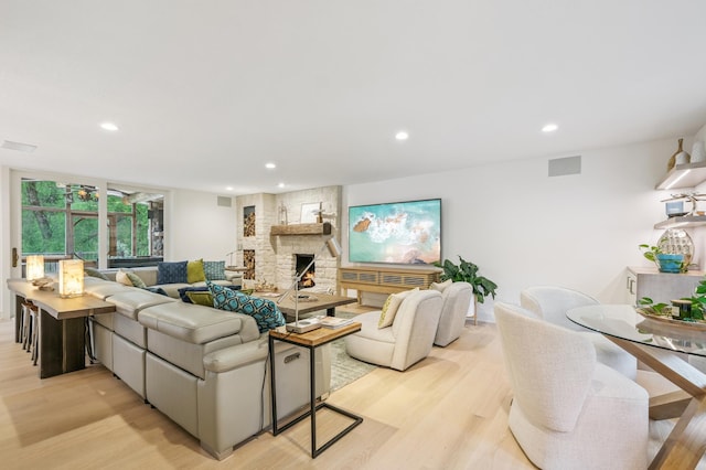 5705 Covington Cir, Minnetonka, MN 55345 - living area featuring light wood-style flooring, a fireplace, and recessed lighting