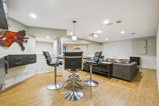 5705 Covington Cir, Minnetonka, MN 55345 - office area with light wood-style flooring, a wainscoted wall, a fireplace, and recessed lighting