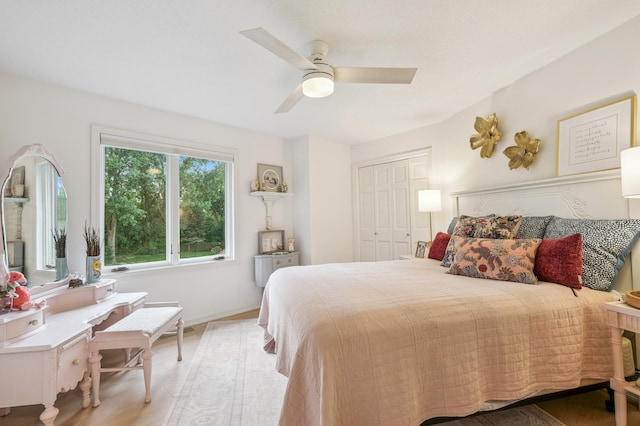 5705 Covington Cir, Minnetonka, MN 55345 - bedroom with light wood-type flooring, a closet, and a ceiling fan