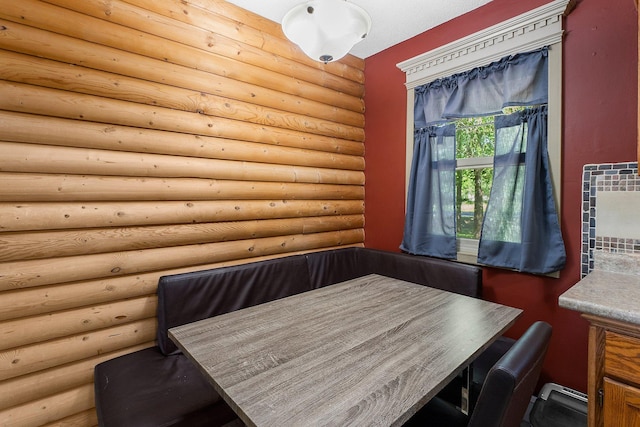 32873 Flanders St NE, Cambridge, MN 55008 - dining room with log walls