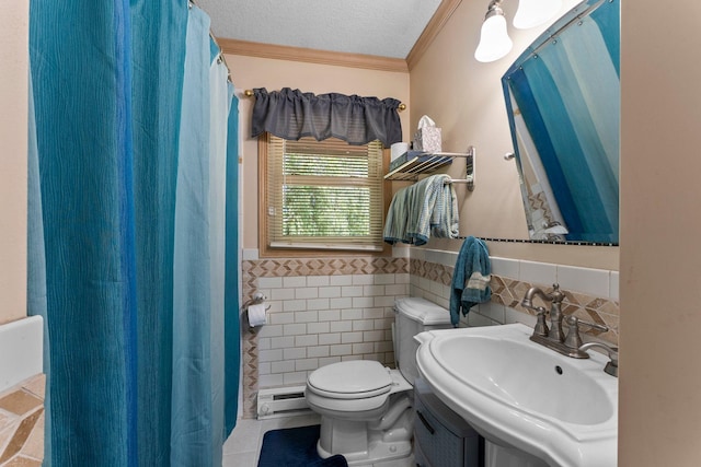 32873 Flanders St NE, Cambridge, MN 55008 - bathroom featuring baseboard heating, tile walls, crown molding, wainscoting, and curtained shower
