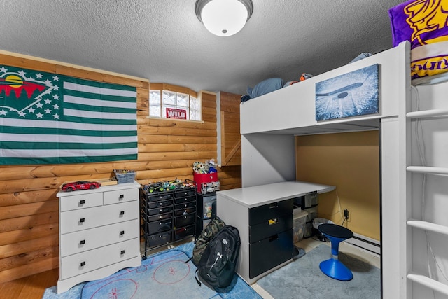 32873 Flanders St NE, Cambridge, MN 55008 - bedroom with log walls and a textured ceiling