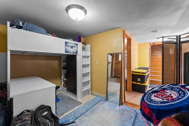 32873 Flanders St NE, Cambridge, MN 55008 - bedroom featuring a textured ceiling and refrigerator
