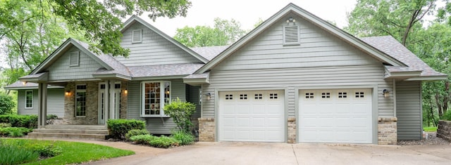 8980 160th Ln NW, Ramsey, MN 55303 - view of front of house with an attached garage, concrete driveway, roof with shingles, and brick siding