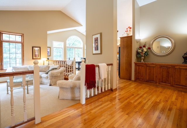 8980 160th Ln NW, Ramsey, MN 55303 - living area with high vaulted ceiling and light wood-style floors