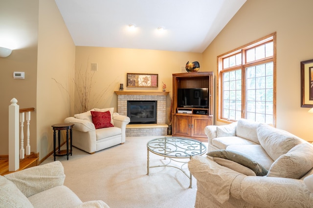 8980 160th Ln NW, Ramsey, MN 55303 - living area featuring lofted ceiling and a fireplace