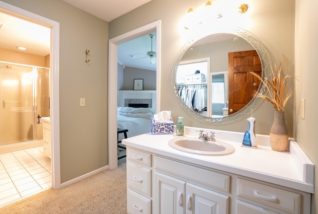 8980 160th Ln NW, Ramsey, MN 55303 - full bath featuring a ceiling fan, vanity, a shower stall, a fireplace, and tile patterned floors