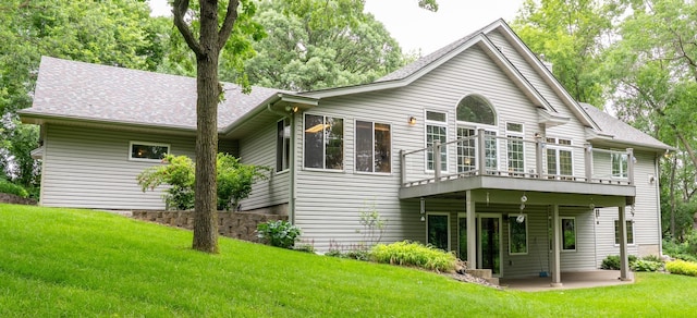 8980 160th Ln NW, Ramsey, MN 55303 - rear view of property featuring a lawn, a wooden deck, and a shingled roof