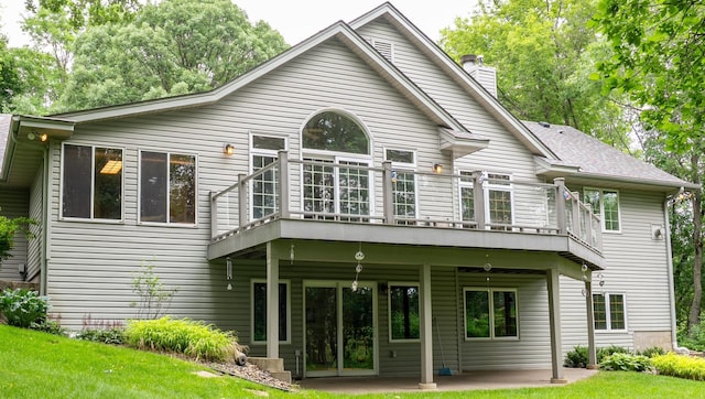 8980 160th Ln NW, Ramsey, MN 55303 - rear view of property with a chimney, a wooden deck, a patio area, and a yard