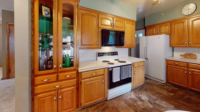507 Hawthorne St, Albert Lea, MN 56007 - kitchen featuring white appliances, backsplash, light countertops, glass insert cabinets, and dark stone finish floors