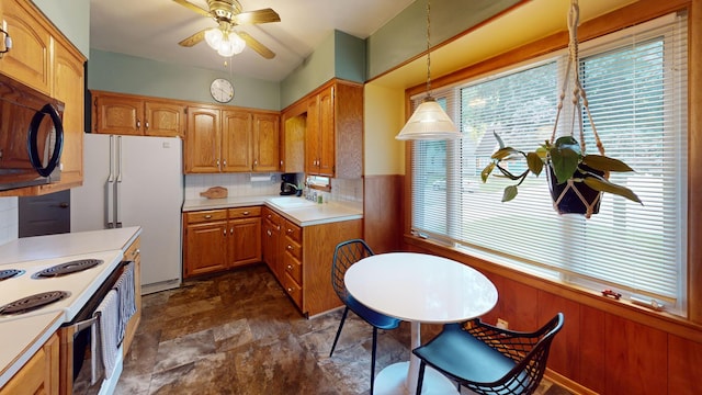 507 Hawthorne St, Albert Lea, MN 56007 - kitchen with ceiling fan, light countertops, stone finish flooring, white appliances, and brown cabinets