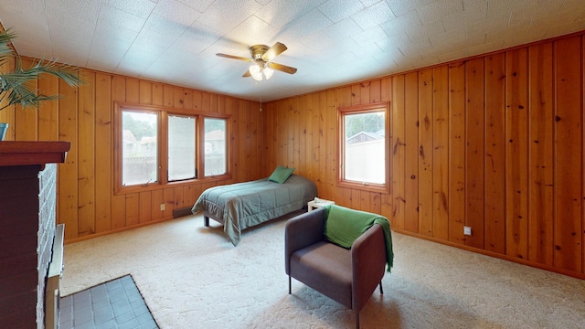 507 Hawthorne St, Albert Lea, MN 56007 - carpeted bedroom featuring wood walls and a ceiling fan